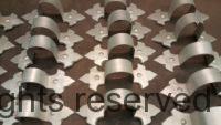 Fleur-de-Lis Freedom Gray Copper Ornamental Downspout Bands with custom angle